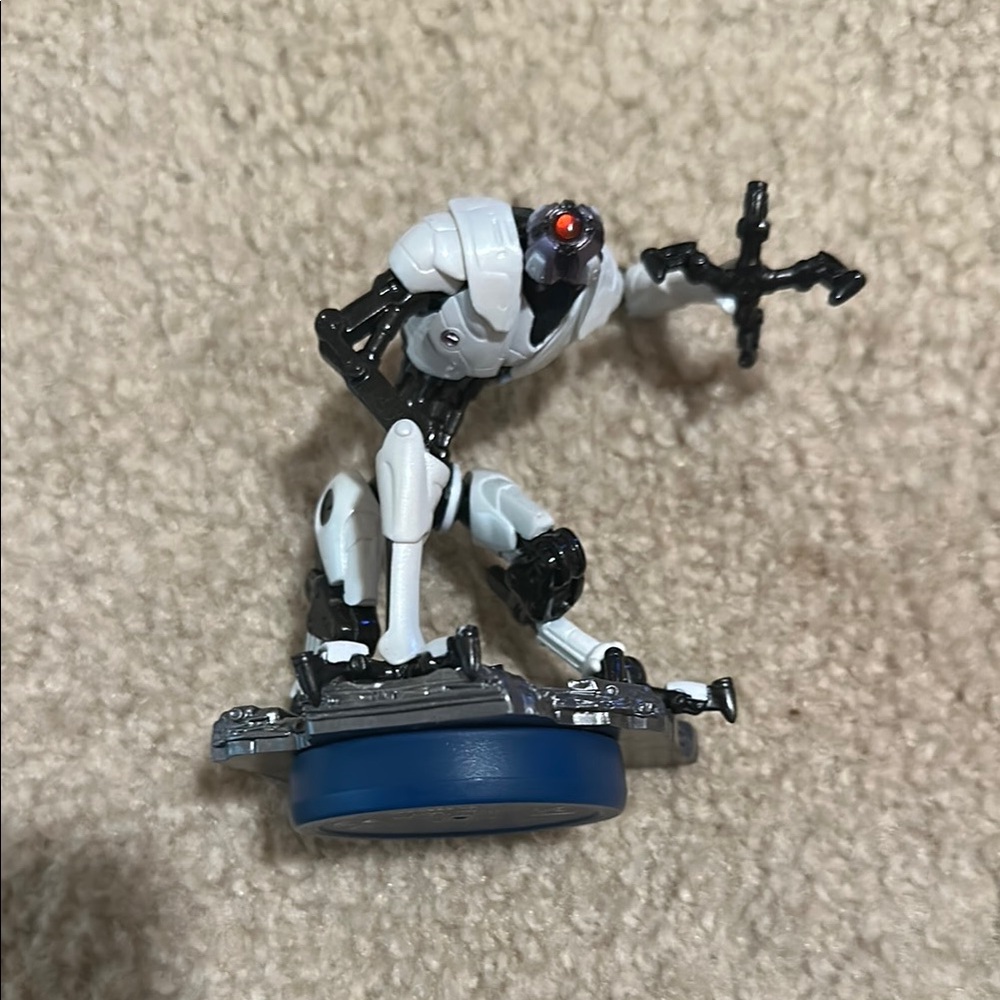 White and Black Robot Figurine